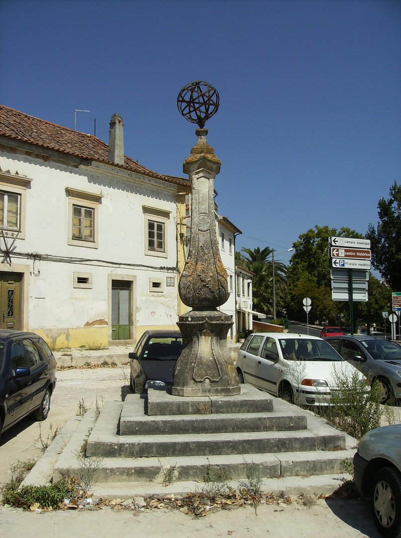 The top has a large armillary sphere, in iron, upon a rustic dome.