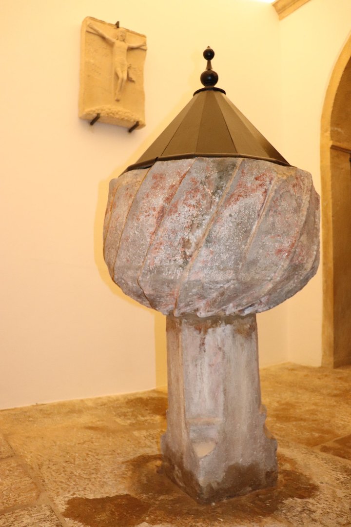 Interior of the Baptistery with a baptismal font from the 19th century