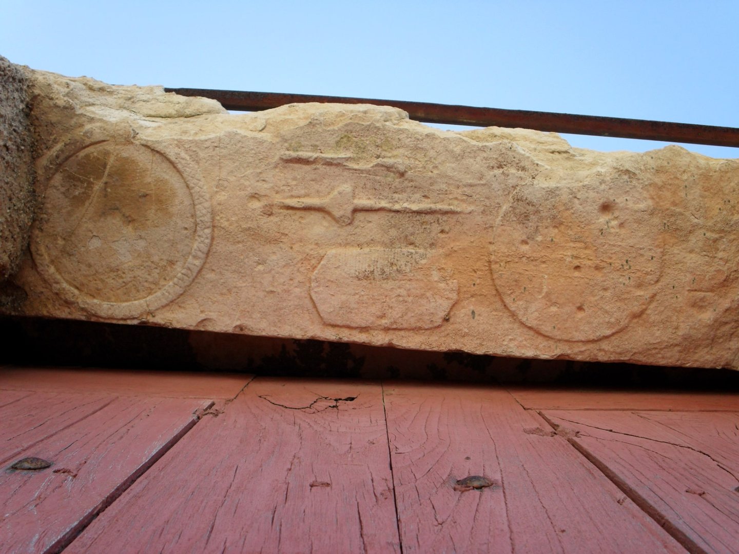 Detail of the door lintel with carved details, reused from a 7th century funerary tombstone