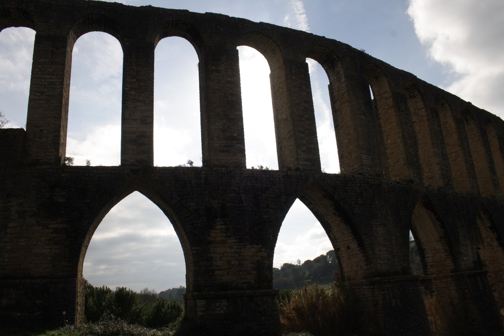 It consists of simple arcades and two layers of overlapping arches in the area with the steepest slope